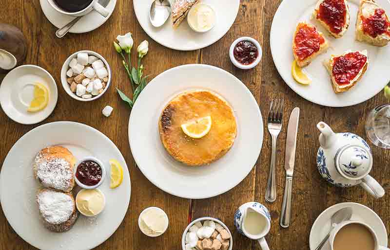Sally Lunn's table Variety of dishes and beverages including a Sally Lunn bun.