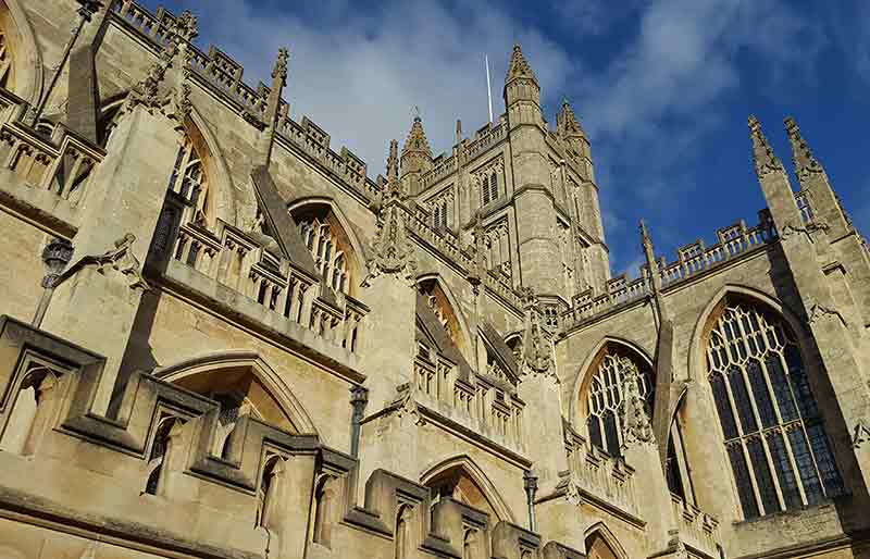 Bath Abbey Gothic architecture and yellow stone of the exterior.