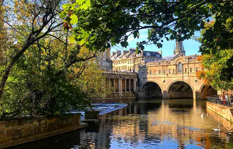 Pulteney Bridge Spanning the river with arches and shops.