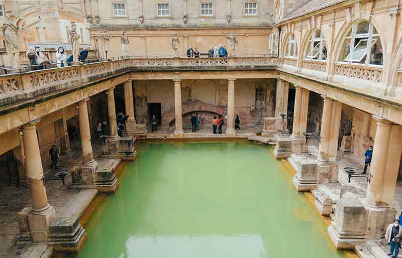 Roman Baths The water and architecture from street level.