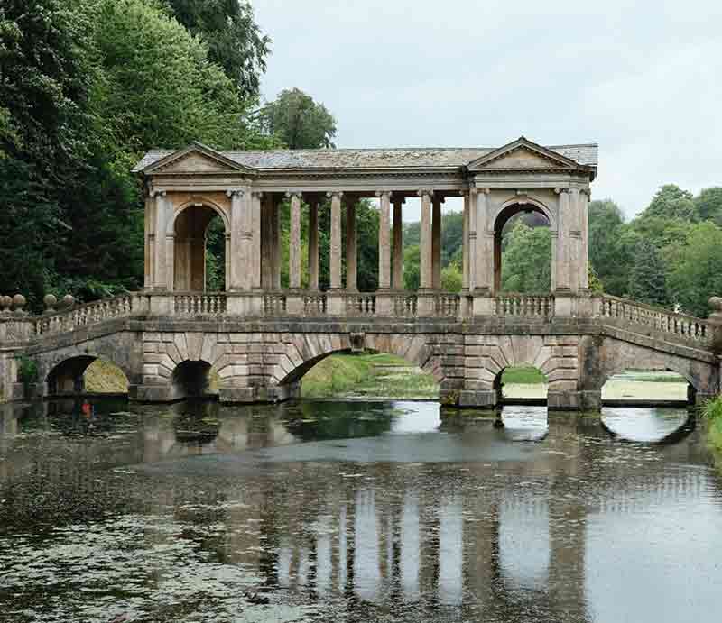 Prior Park Landscape Garden Palladian Bridge reflected in the water.