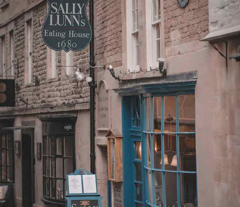 Sally Lunn's Historic Eating House exterior Shop frontage with blue-painted bow panelled window and sign with date 1680.
